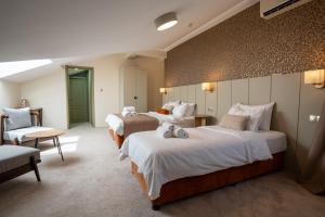 Postel nebo postele na pokoji v ubytování Saffron Boutique Hotel