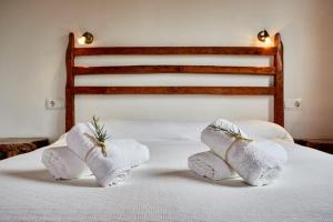 a bed with towels on top of it at Casa Rustick in Sant Francesc Xavier +25 photos