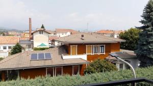 a house with a solar panel on the roof at QuickHome Appartamento Il Melograno in Biella