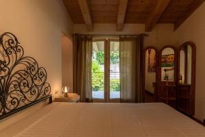 Postel nebo postele na pokoji v ubytování iFlat Penthouse Superpanoramico Trento Villazzano