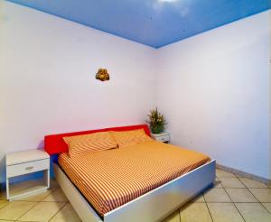 A bed or beds in a room at Residence Giuliana