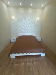 a bedroom with a bed in a room at Аркадия с панорамой моря in Odesa