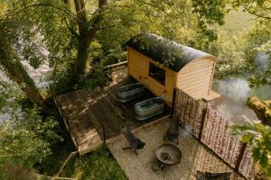 an overhead view of a dog house with plants on it at Curlew Lodge Yorkshire in West Tanfield