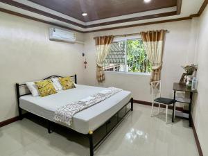a bedroom with a bed and a window at Yoga Bed and Breakfast in Chiang Mai +37 photos