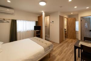 Giường trong phòng chung tại 安楽居