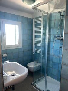 a bathroom with a shower and a sink and a toilet at Dimora i Mandorli 2 in Colonnella +19 photos