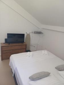 Ένα ή περισσότερα κρεβάτια σε δωμάτιο στο Seaview apartment Lukić