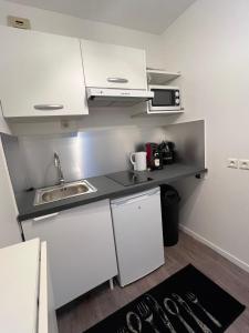 Kuchyň nebo kuchyňský kout v ubytování Le Confidentiel avec parking