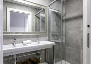 a bathroom with a sink and a shower at Epalza apartment by People Rentals in Bilbao