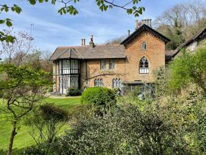 an old brick house on a green field at Rural Victorian Mansion with far reaching views in Wrington