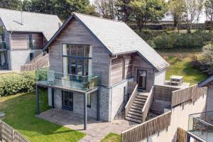 an aerial view of a house with a glass roof at House 32 in Looe