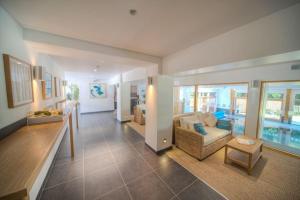 a living room with a couch and a table at House 35 in Looe +20 photos