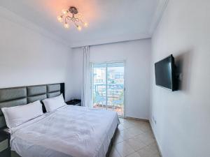 Ένα ή περισσότερα κρεβάτια σε δωμάτιο στο Résidence Riviera beach +41 φωτογραφίες