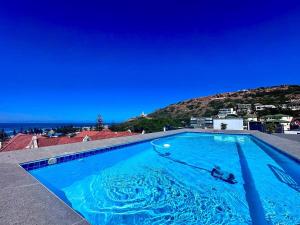 Bazén v ubytování Coral Cove - Mossel Cove Unit 211 nebo v jeho okolí