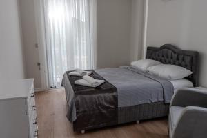 Postel nebo postele na pokoji v ubytování Villa Begonvil + 8 fotografií