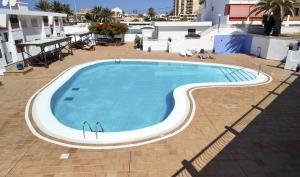 The swimming pool at or close to Vera Mar 9C - Primera linea con Parking y TV Sat