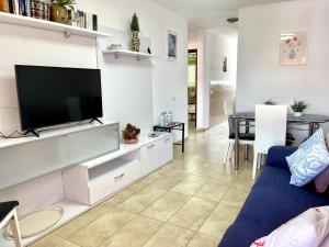 A television and/or entertainment centre at Vera Mar 9C - Primera linea con Parking y TV Sat