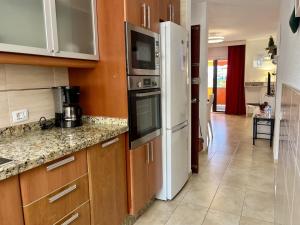 A kitchen or kitchenette at Vera Mar 9C - Primera linea con Parking y TV Sat