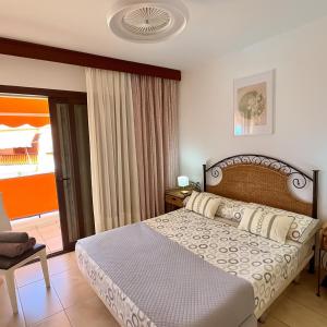 A bed or beds in a room at Vera Mar 9C - Primera linea con Parking y TV Sat