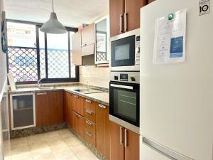 A kitchen or kitchenette at Vera Mar 9C - Primera linea con Parking y TV Sat
