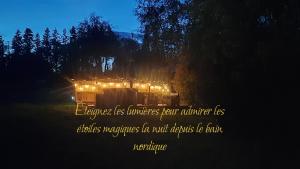 a picture of a house lit up at night at Sérénité Verte à La Tuilerie Accommodation in La Bazeuge