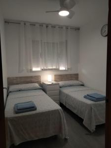 Postel nebo postele na pokoji v ubytování Costa Azahar 1 + 20 fotografií