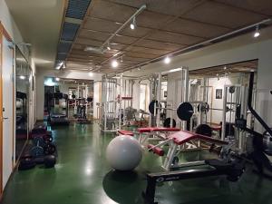a gym with lots of equipment in a room at Filipstad, Lake House Fishing, Nature, Beach in Filipstad