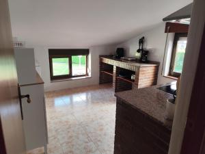 a kitchen with a sink and a counter top at La Casa de Tito y Cosi in Noja