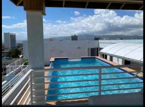 a swimming pool on the roof of a building at Joy Luxury Estate Kingston in Kingston