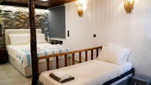 a bedroom with two bunk beds in a room at Fevanti - Luxury Guest House in Skiathos Town