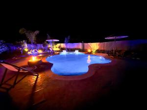 a swimming pool at night with lights at La casa di pantelis with Luxury Pool in Archangelos