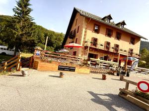 a large building with a sign in front of it at LE PETIT CERF in Cervières