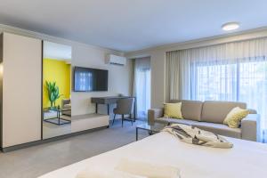 a living room with a couch and a table at CityZen - Boutique Studios in Achrafieh in Beirut
