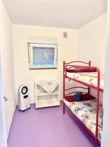a room with two bunk beds and a window at Villa Lory Krk in Krk +80 photos
