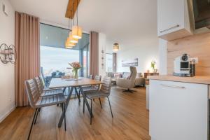 Kuchyň nebo kuchyňský kout v ubytování Hygge – Familienfreundliche Ferienwohnung mit Garten & Meerblick