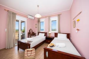 Ένα ή περισσότερα κρεβάτια σε δωμάτιο στο Villa Chloe +39 φωτογραφίες