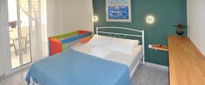 Krevet ili kreveti u jedinici u okviru objekta Agapi Apartments +37 fotografija
