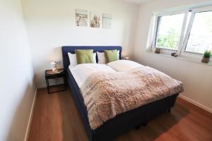 Postel nebo postele na pokoji v ubytování KÜSTE33/24 – Exklusive Ferienwohnung mit Sauna & nah am Strand!