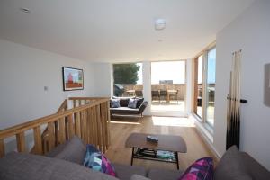 a living room with a couch and a table at House 47 in Talland