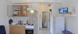 A kitchen or kitchenette at Agapi Apartments