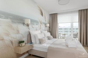 Ένα ή περισσότερα κρεβάτια σε δωμάτιο στο Baltini Premium Apartament Polanki Aqua