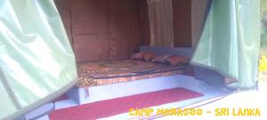 Ένα ή περισσότερα κρεβάτια σε δωμάτιο στο Camp Moragoo