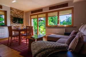 a living room with a couch and a table at Cyrhla przy szlaku in Zakopane