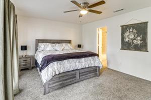 a bedroom with a bed and a ceiling fan at Home 4 Mi to ATandT Stadium Bring Your Pets! in Arlington