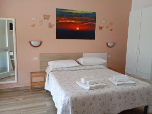 A bed or beds in a room at B&B da AnnaMaria