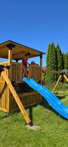 a person on a slide in a playground at Posejdon in Ustronie Morskie