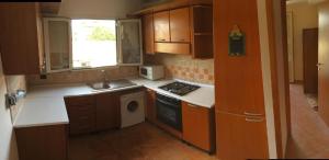 a kitchen with a sink and a stove top oven at Attici Sunny Rome in Rome +3 photos