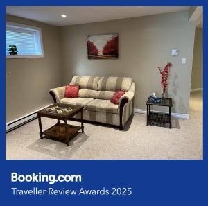 a living room with a couch and a table at Green House in St. John's