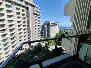 an apartment balcony with a view of buildings at Brenttstaycation at Tambuli Living Tower C,10D unit in Lapu Lapu City