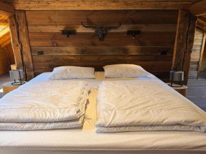 Ένα ή περισσότερα κρεβάτια σε δωμάτιο στο Spacious Chalet in Ovifat